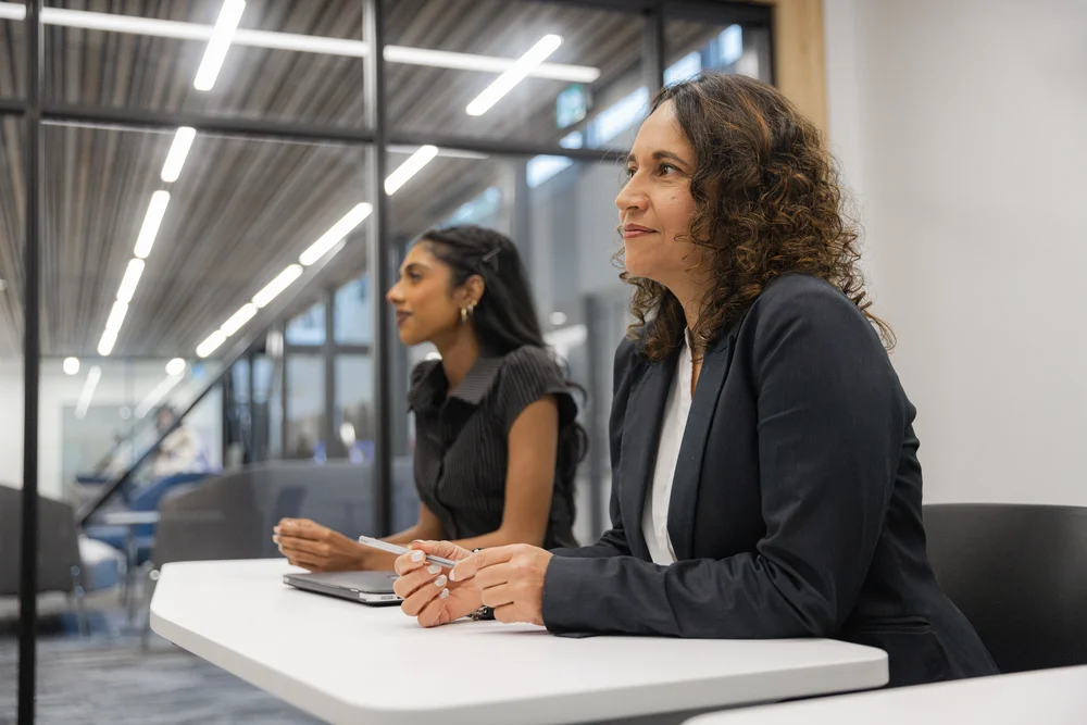 A student in business attire in a professional setting