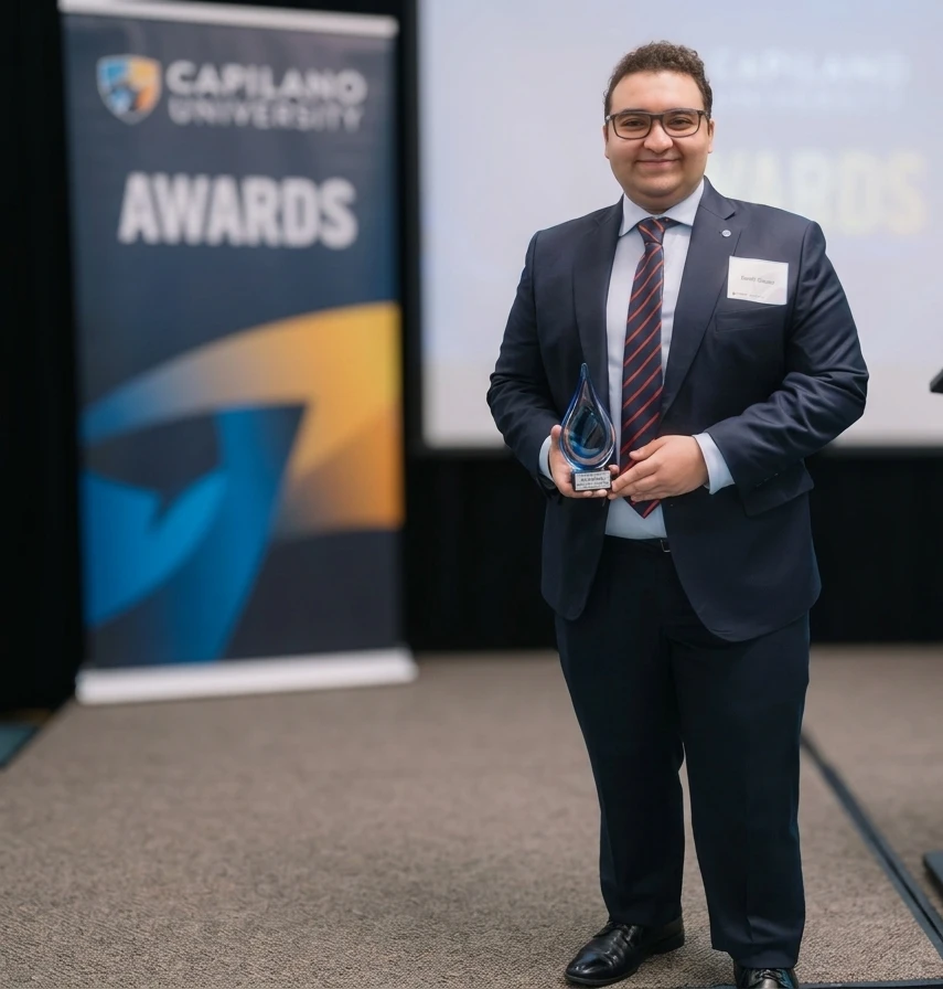 Kaveh Sanei accepting the 2026 WIL Student of the Year award