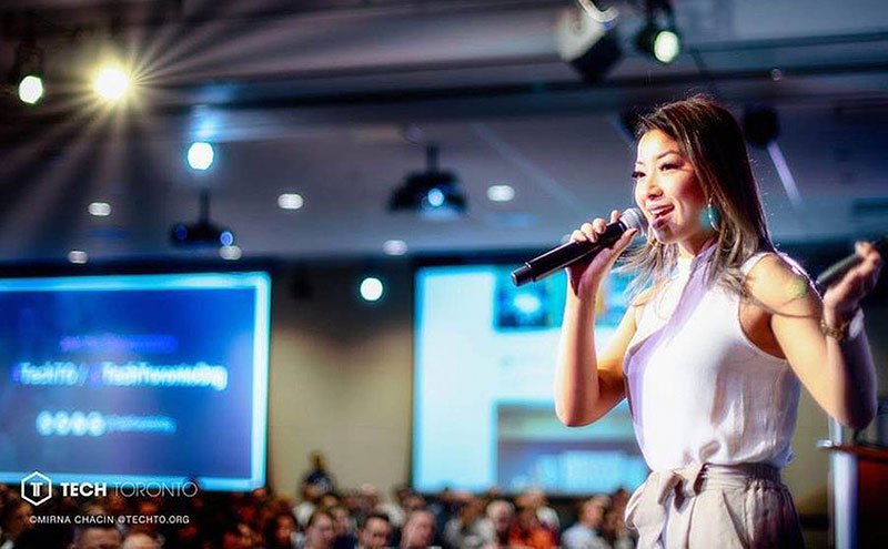 Alum speaking at an event