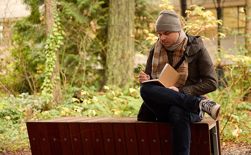 Student reading on campus