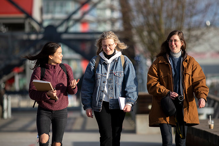 Students talking and walking outside