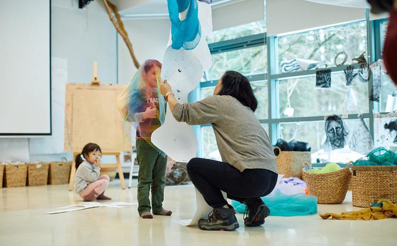 Student with child in Centre