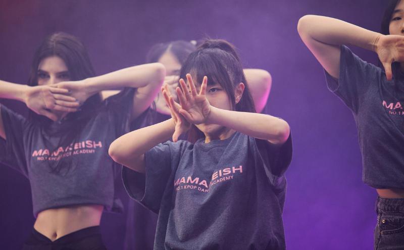 A group of students in a K-Pop performance