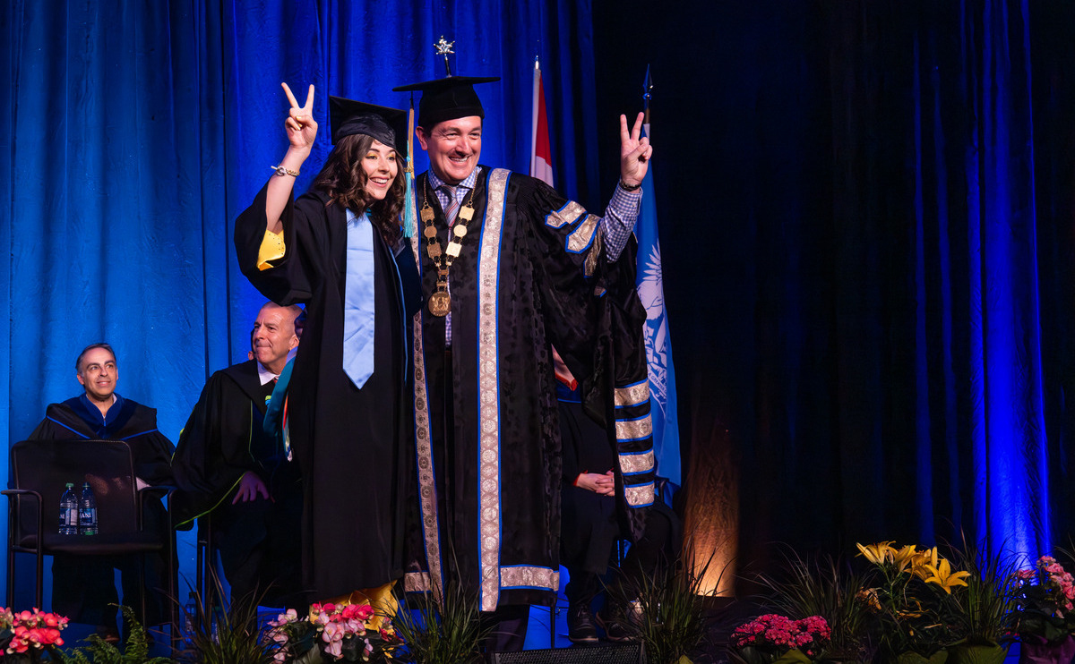 MOPA graduate and student speaker Zanthia Bérubé with Chancellor Yuri Fulmer