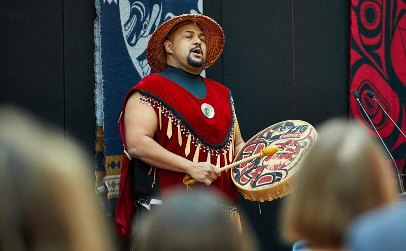 Alumnus Willie Lewis performs at the launch of Chén̓chenstway, Capilano University's commitment to reconciliation and continuous learning