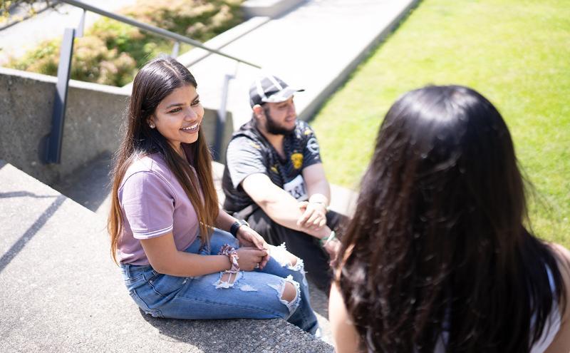 Students sitting outside of the Birch Building