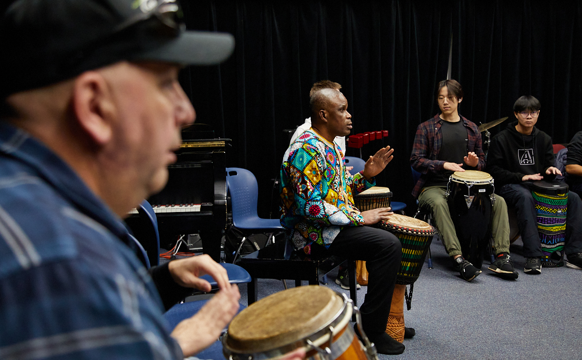 Students learning the art of drumming