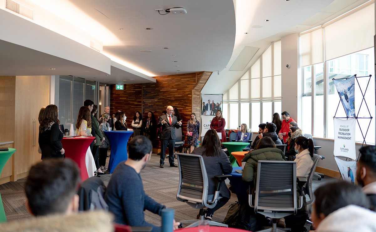 The federal minister of tourism Randy Boissonnault visits and speaks with students