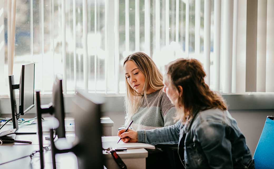 CapU student getting help with an assignment at Sunshine Coast campus.
