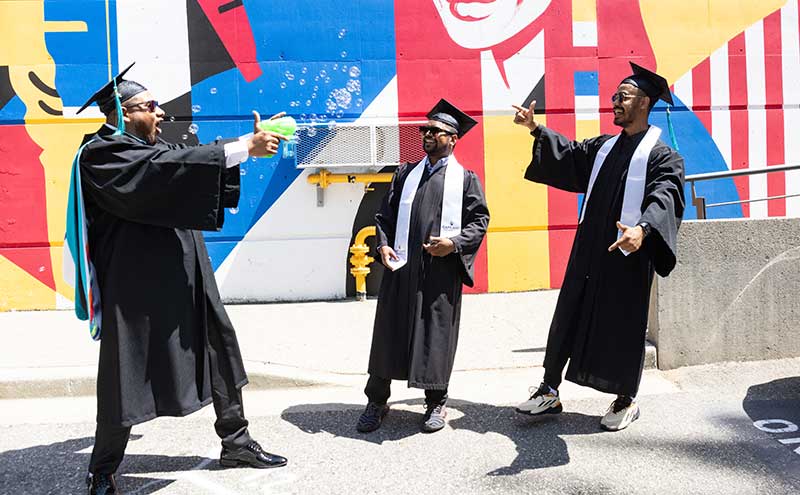 Graduates having a bubble fight.