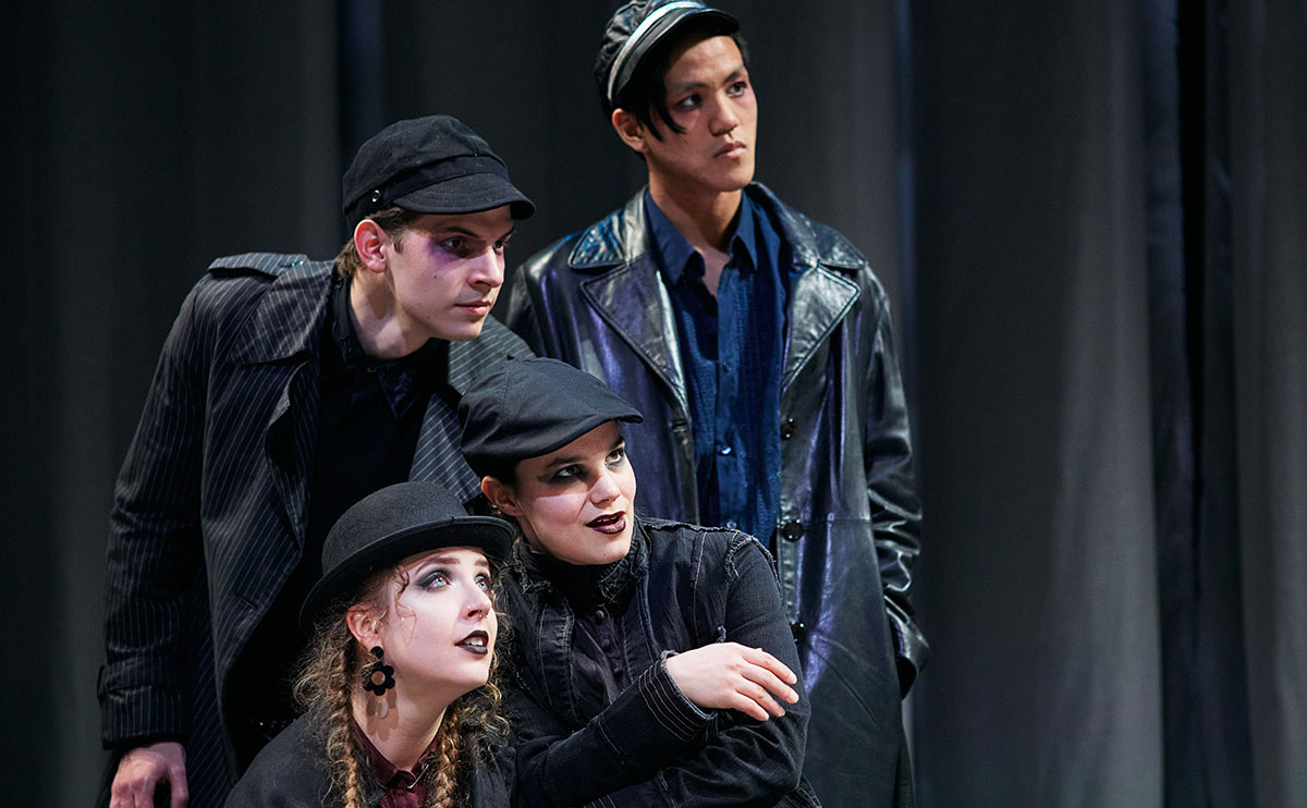 Students performing in theatre production