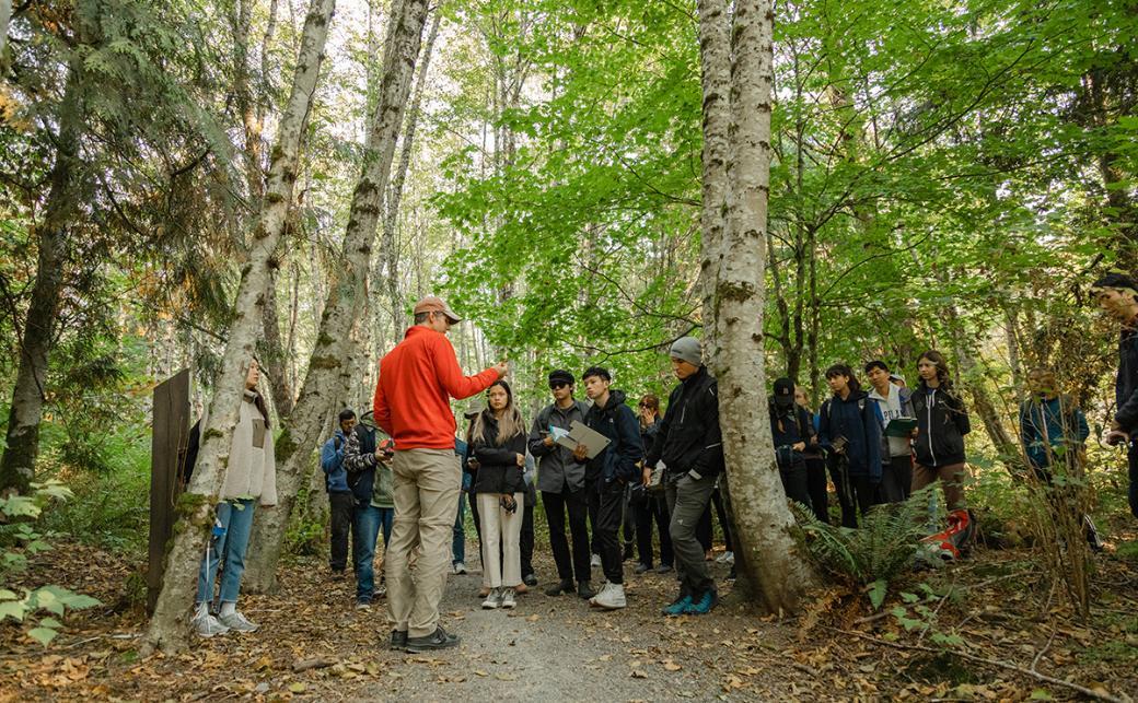 Instructor teaching students outside