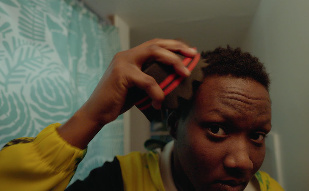 CapU 2D Animation student JoWayne McFarlane styling their hair.