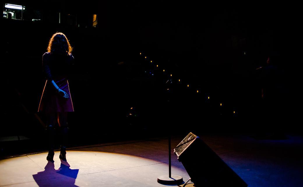 Performer on stage in The BlueShore Theatre at Capilano University