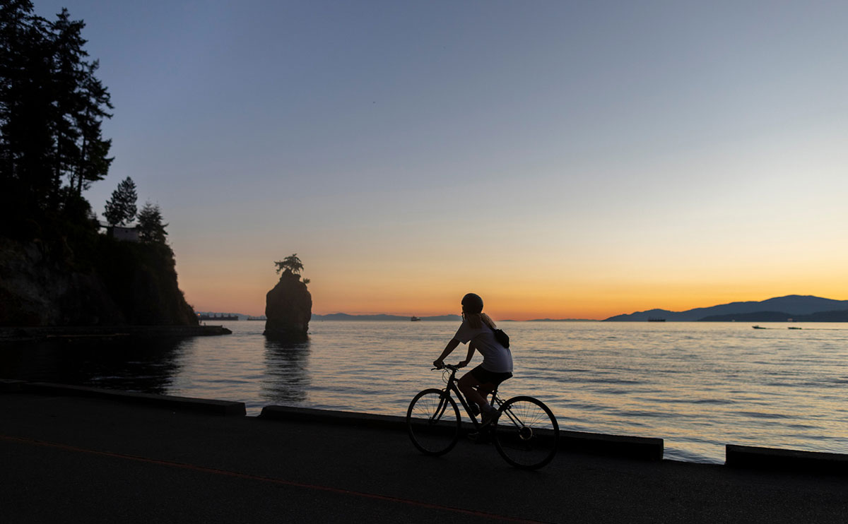 Grace Hardman riding bike on Stanley Park SeaWall