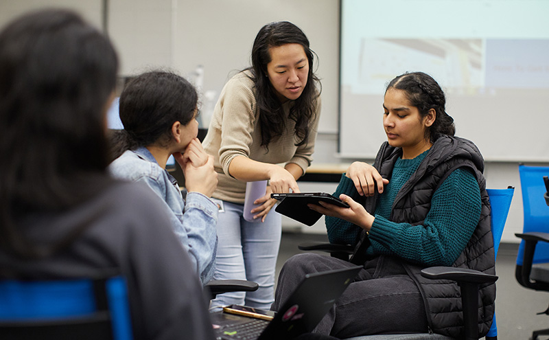 Grace Kim in classroom with students