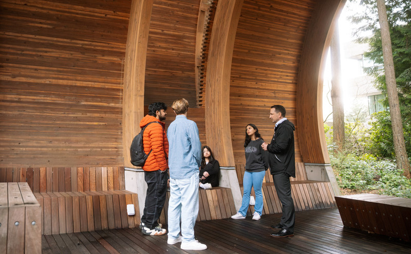 Dr. Dewling meeting with students at the Indigenous Pavilion.