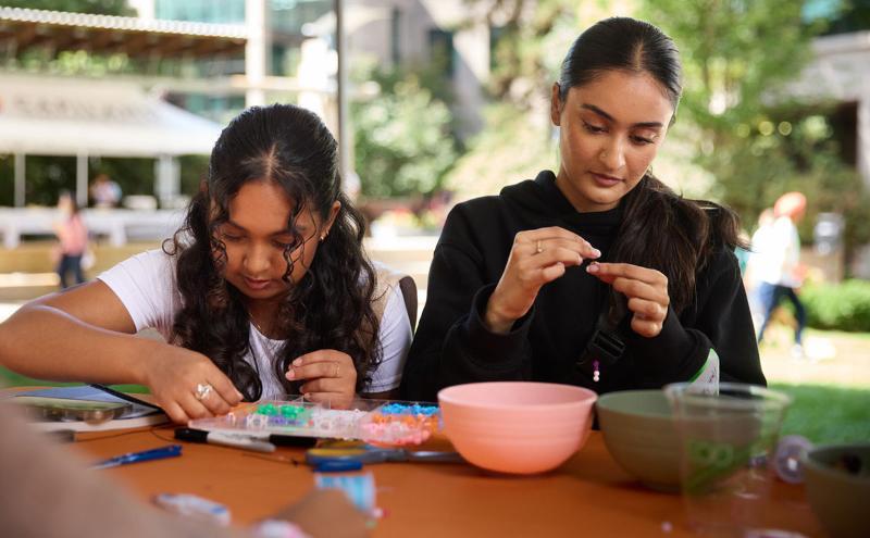 Students making bracelets during the Fall term’s first Welcome Wednesday