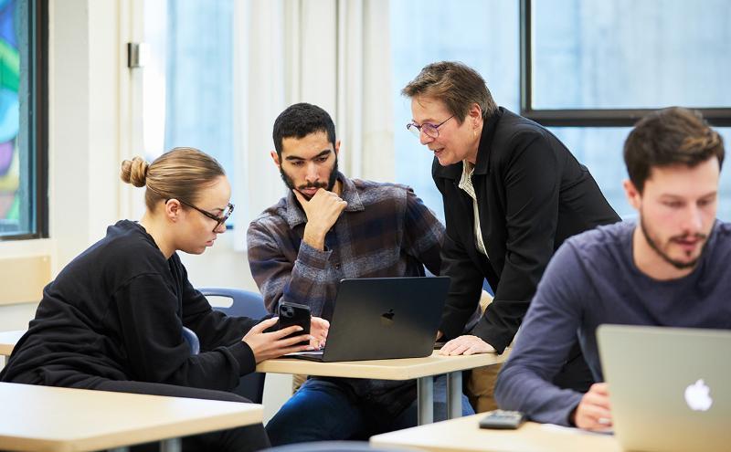 Students talking to instructor