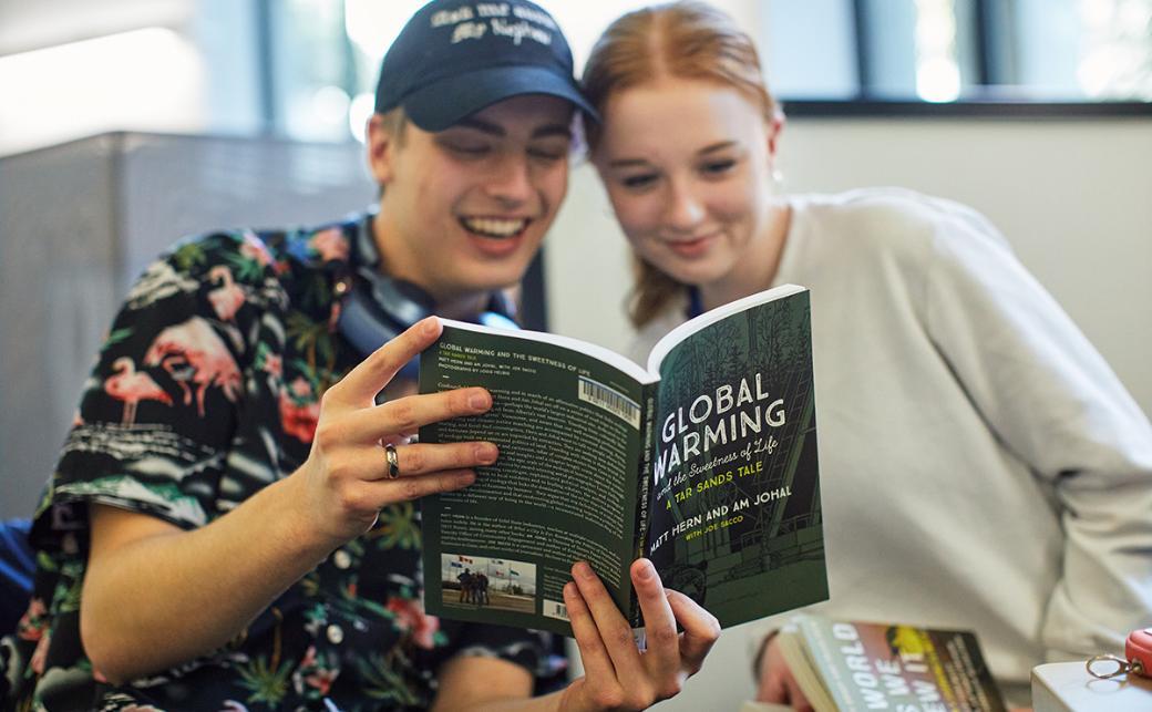Students reading a book in the Library