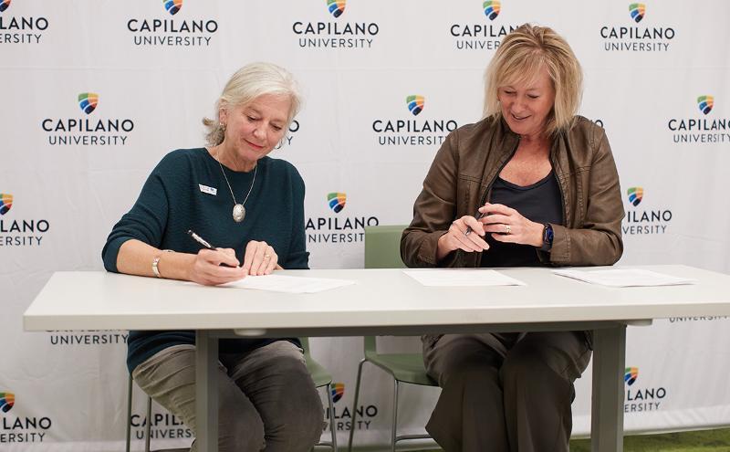 Laureen Styles, vice president, academic & provost and Ruth Simons from Howe Sound Biosphere Region Initiative Society sign a memorandum of understanding to solidify an official partnership and working group with Capilano University to support student and community research projects in the region