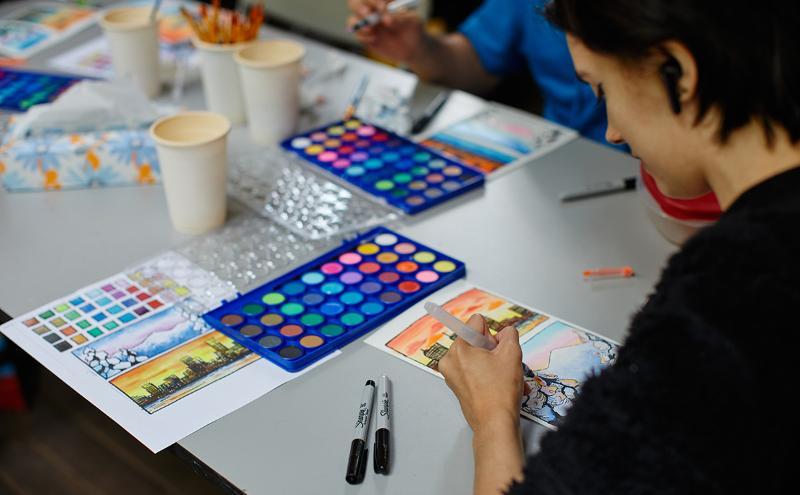 Putting the final touches on her drawing