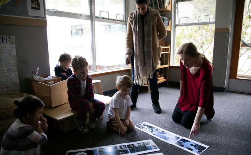 An early childhood educator does an activity with children at the Capilano University Children's Centre 