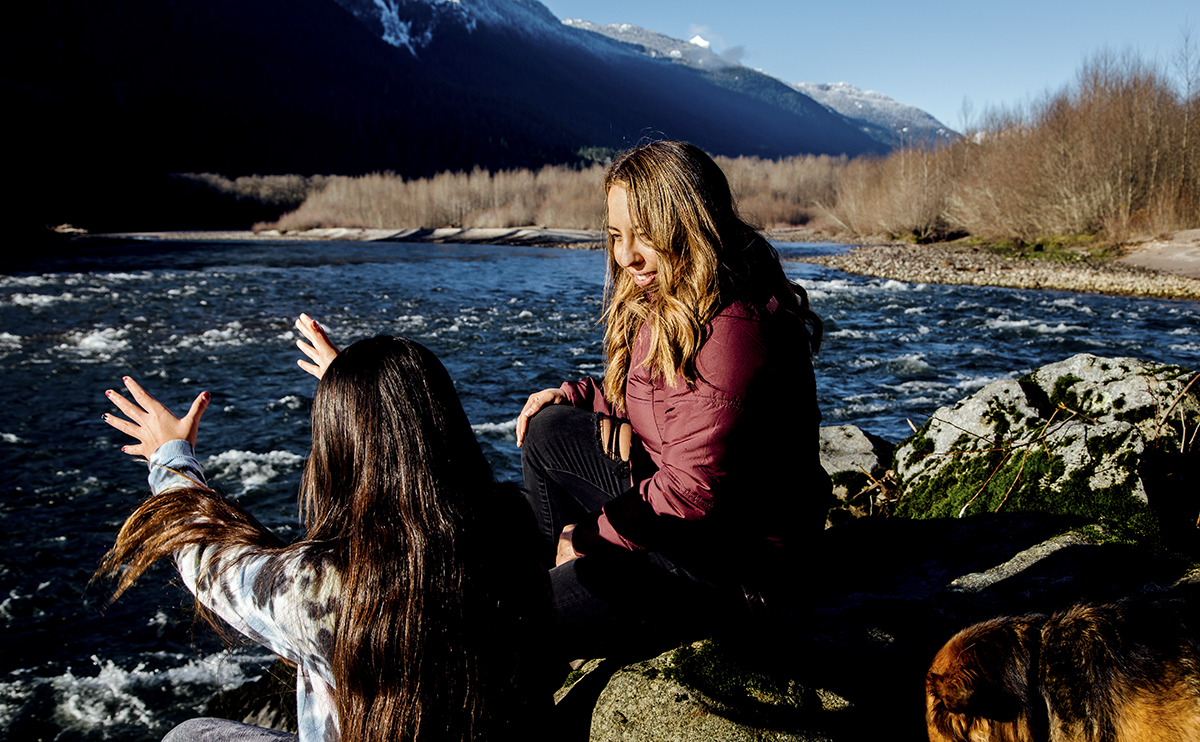 April Newman with girls by a river