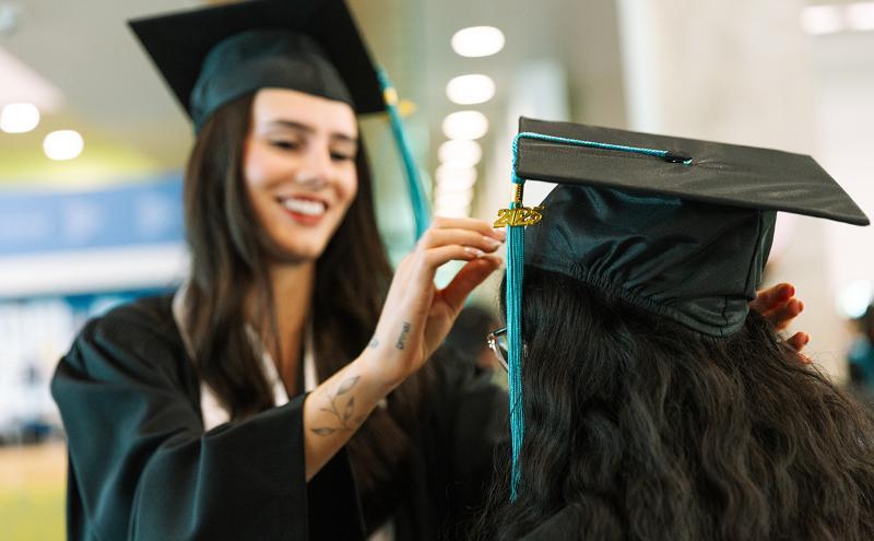 Preparing to cross the stage—with a little help from a friend