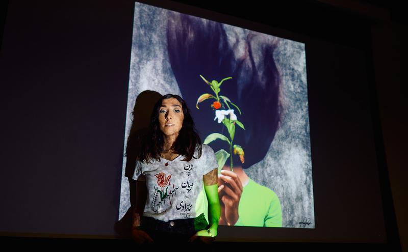 CapU Arts and Entertainment Management student Saghi Ehteshamzadeh along with her artwork protesting the lack of women’s rights in Iran.