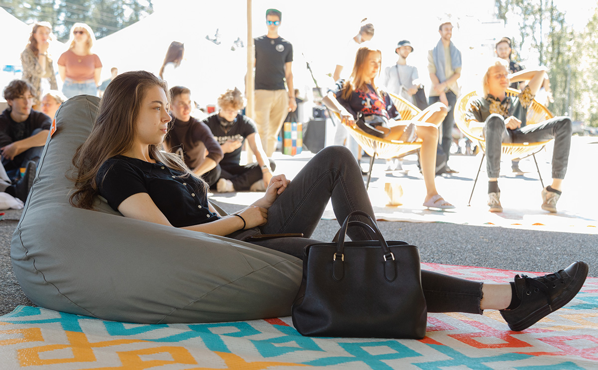 Students check out live-music performances in an area set up for relaxing.