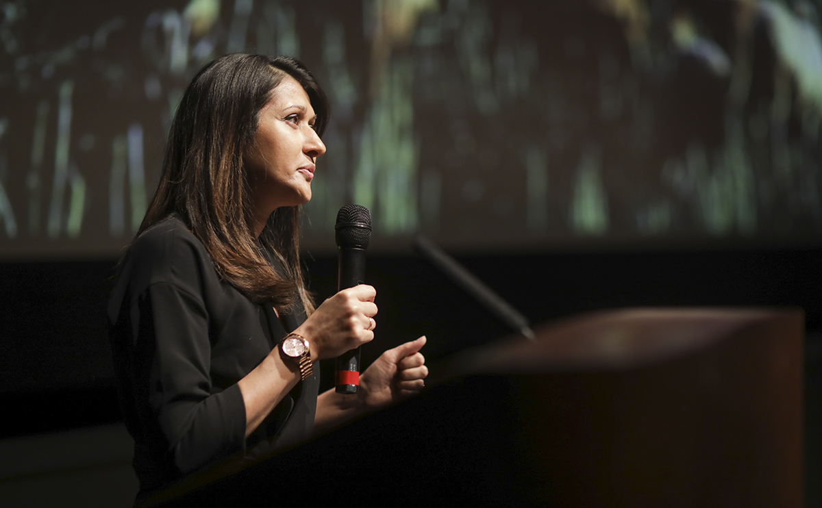Juvarya Veltkamp speaking at a podium