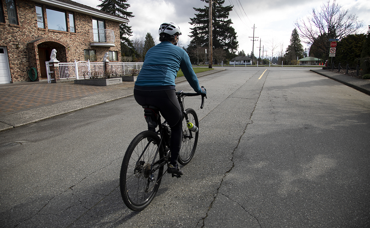 Nazmi Kamal biking in a neighbourhood