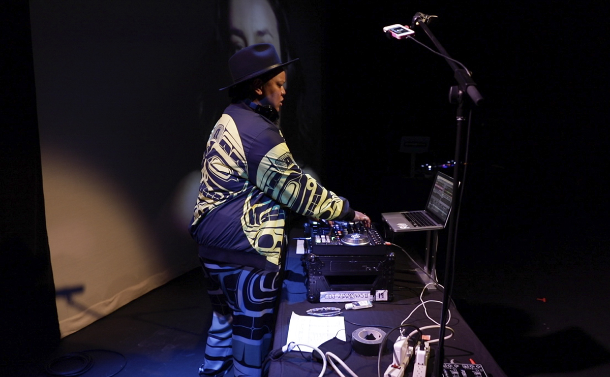 Orene Askew at a DJ table