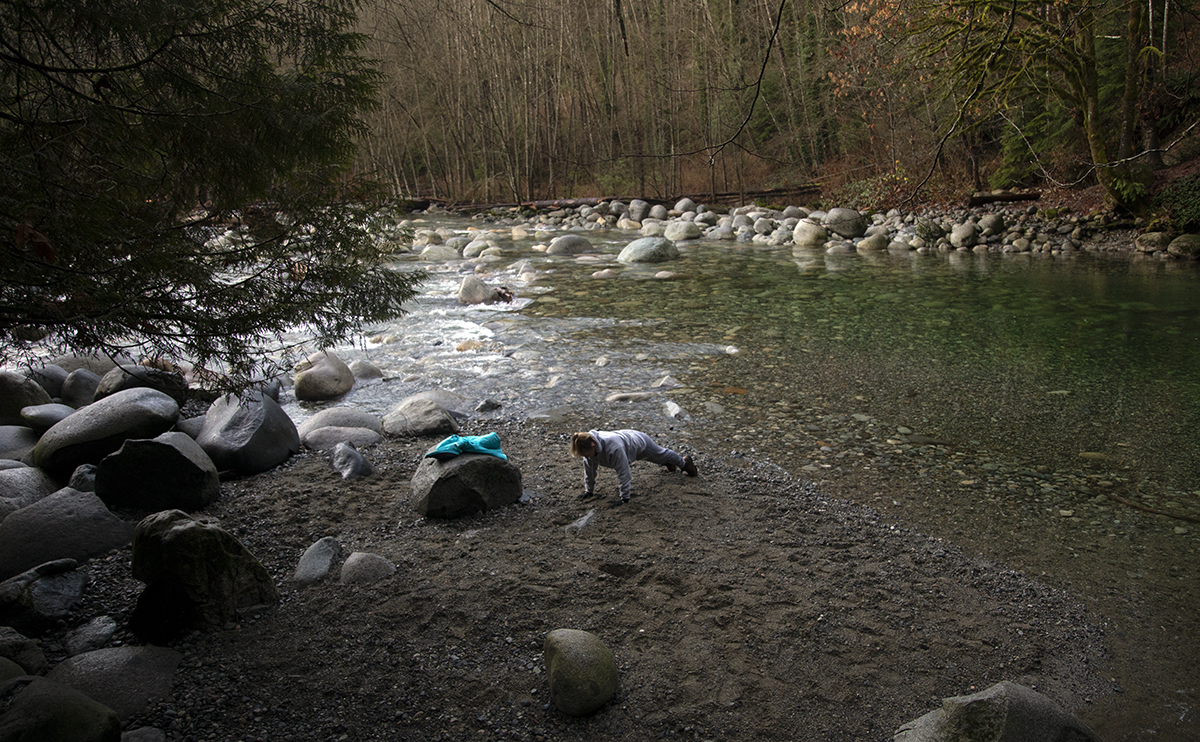 Samantha Doyle doing push ups by a river