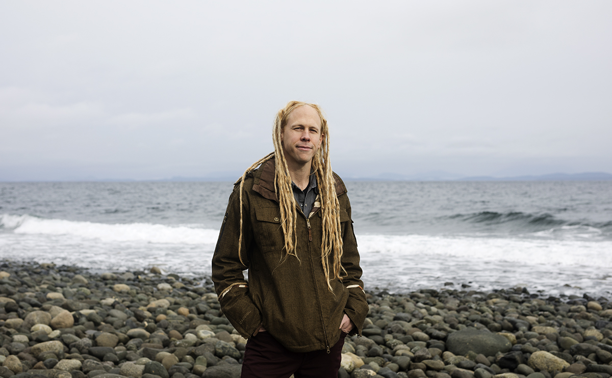 Portrait of Sean Aiken standing on a beach
