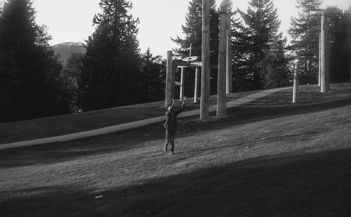 Man catching flying disc in a park