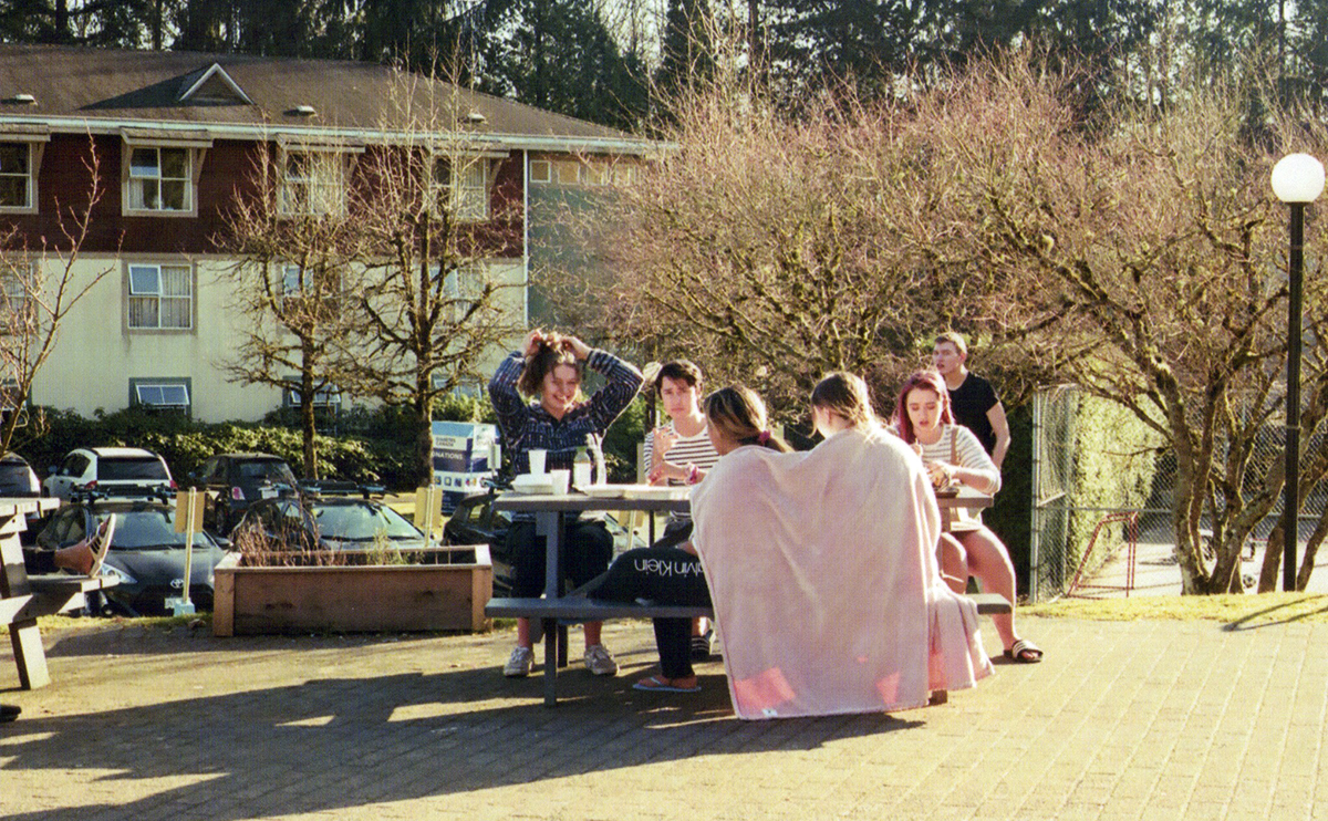 Students sitting at a picnic table