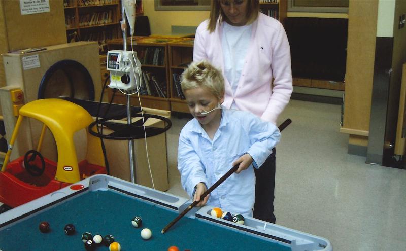 Thomas playing pool