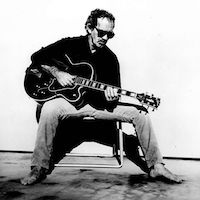 JJ Cale playing guitar