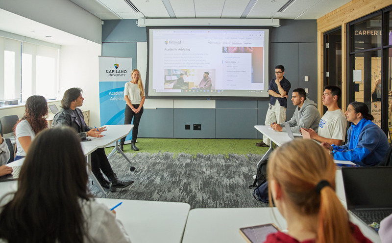 An academic advisor giving a workshop presentation to students