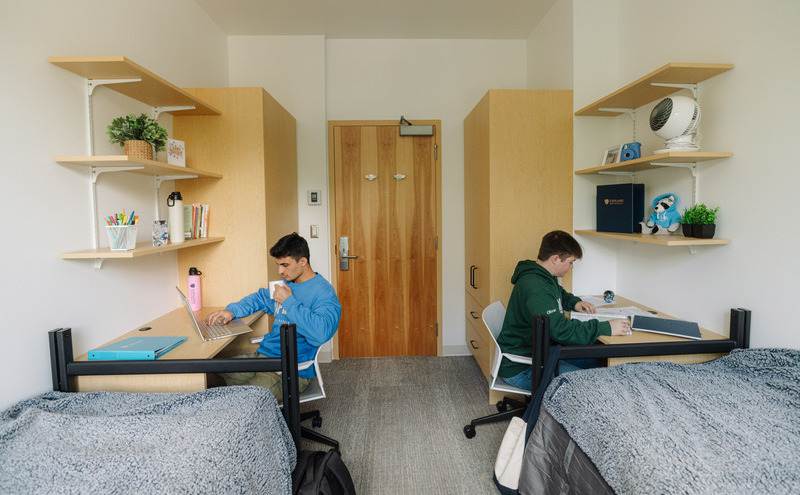 Two students in their student room