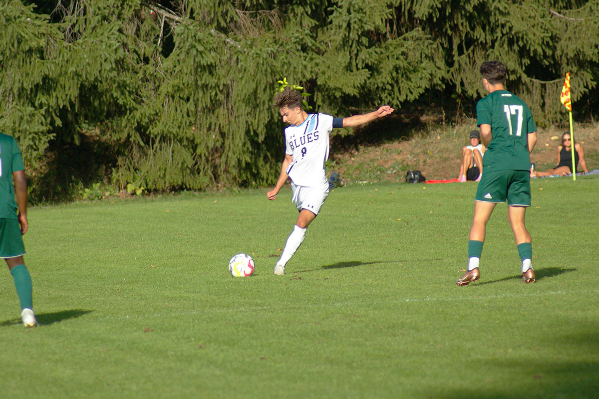 Blues midfielder Luca Martinelli steps into a free kick as part of a 2-2 tie Saturday, Sept. 16 against Douglas College Saturday, Sept. 16 at Lillooet Park.