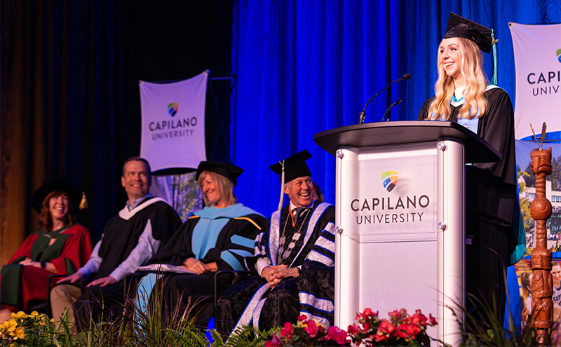 An Arts student stood on stage at Convocation