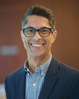 A portrait image of Hussein Janmohamed