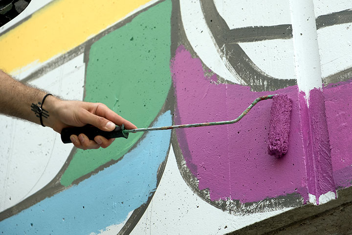 Painting an outdoor mural at our North Vancouver campus.