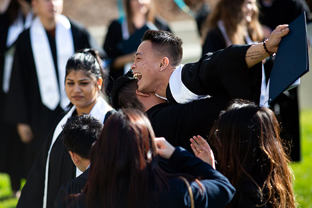 Celebrating with friends at Convocation ceremonies on Feb. 21, 2020. (Photo by Tae Hoon Kim)