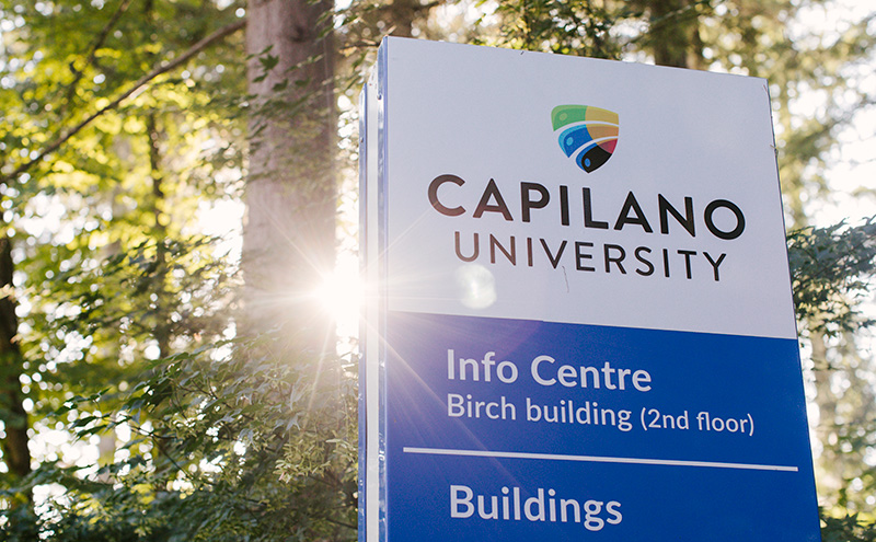 Sign on campus with CapU logo