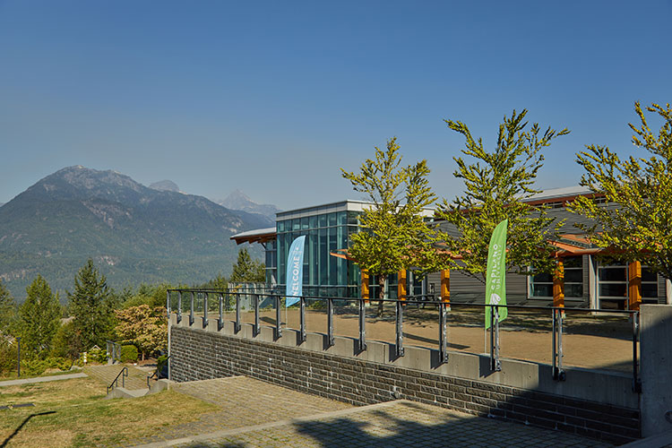 Photo of CapU Squamish Campus looking out over the mountains.