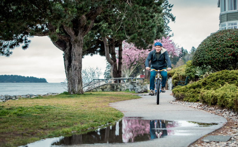 A student riding a bike on the Sunshine Coast